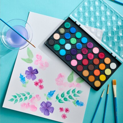 Watercolor Painting on a table with a paint set