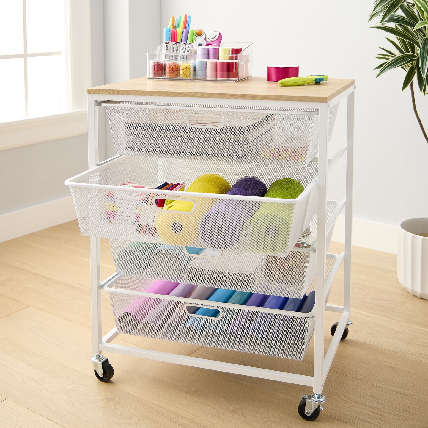 Metro White 4 Drawer Rolling Cart by Simply Tidy® stocked with various crafting supplies