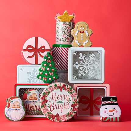 Holiday baking supplies and cookie cutters on a baking sheet with The Party Shop logo