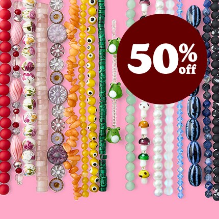 Strung Beads layed in rows in rainbow order