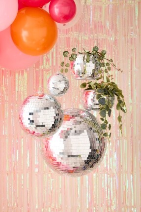 hanging disco balls with irridescent background