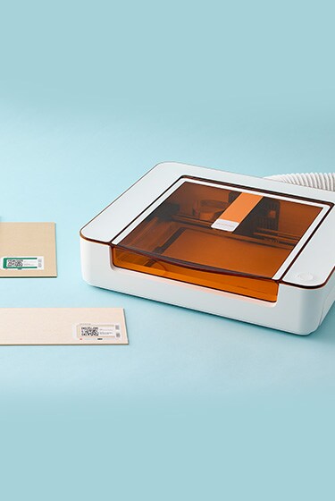cricut printer on table with frame