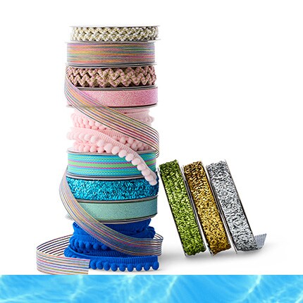 colorful spools of ribbon in a stack