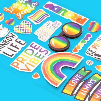 Pride-themed stickers arranged on a blue background.