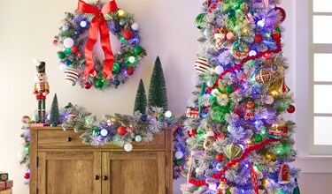 A christmas tree with lights and wreath & garlands