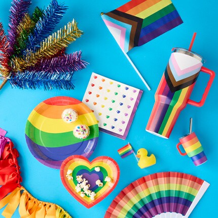 rainbow flag, tumbler and party supplies