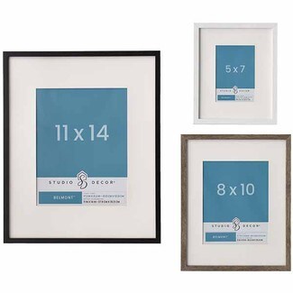 two brown wood and one white wood frames with white matts