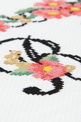 letter be embroidery with pink flower