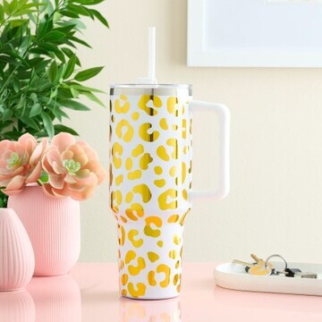 White tumbler with golden vinyl