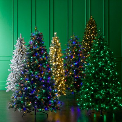 six artifical Christmas trees with color and white lights