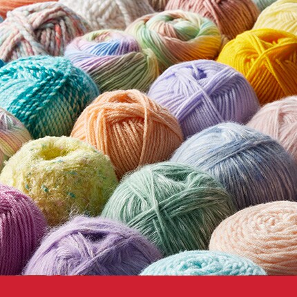 assorted skeins in colorful styles in a pile