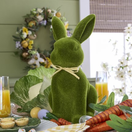 Easter bunny table decor with spring flower candy in a pot