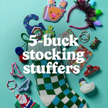 Festive flat lay featuring a green and white checkered stocking surrounded by colorful holiday trinkets and gifts. Text reads "5-buck stocking stuffers."
