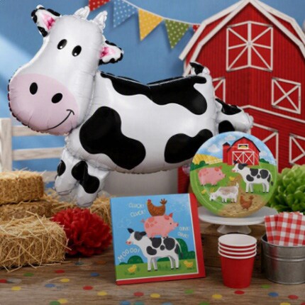 barn party theme decorations with cow shaped balloon