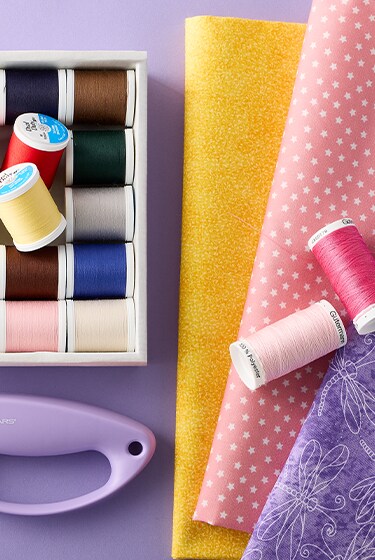 sewing notions on purple background