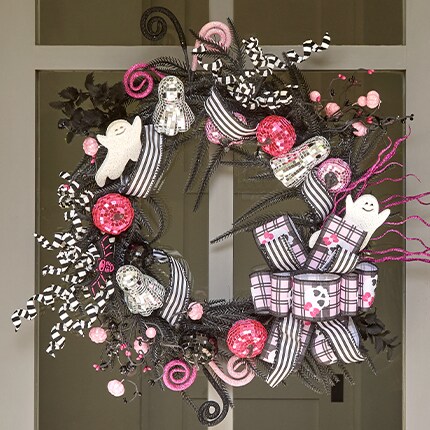 Halloween Decorative Wreath in Black and pink colors, with Ribbon, pumpkins and ghost decorations.