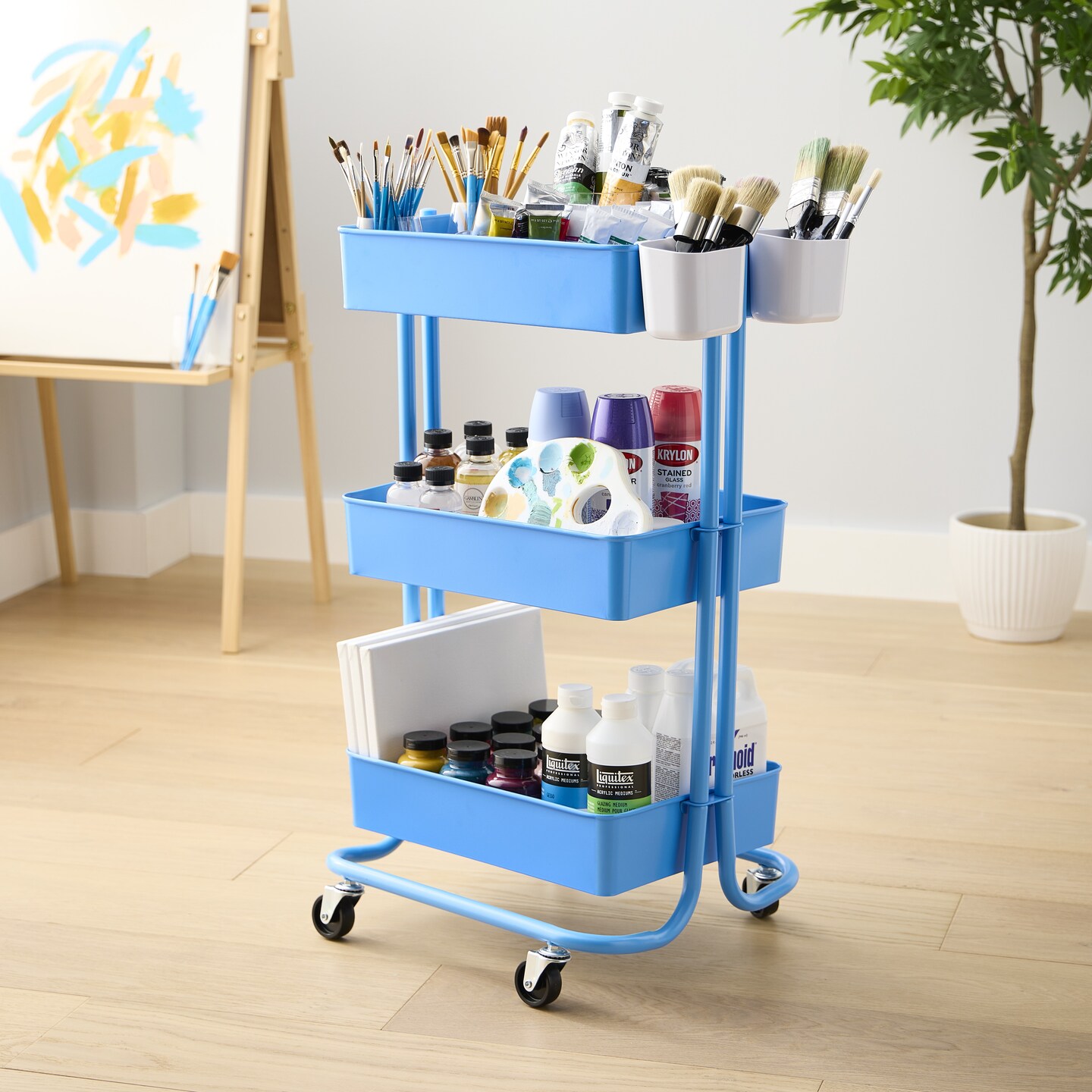 Blue Lexington Rolling Cart stocked with painting and art supplies