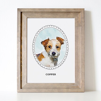 MakerPlace by Michaels A watercolor portrait of a small brown-and-white dog named Copper sits in a rustic wooden frame against a white wall, giving a warm, gentle feel.