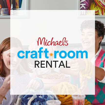 Adults doing a craft together in a craft room