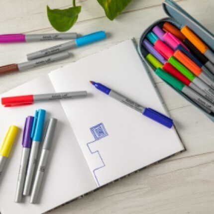 makers sitting on a white pae of a sketchbook