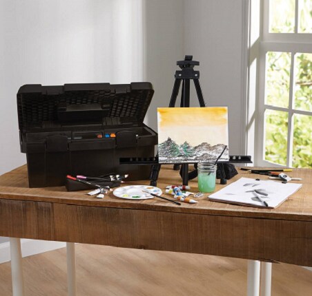 art tool box and easel and paint supplies