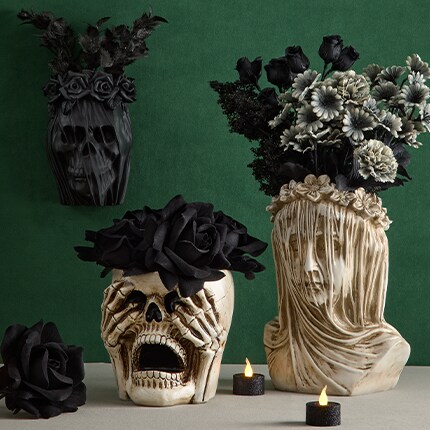 Three Floral bouquets with roses in dark red, dark blue and dark purple colors.