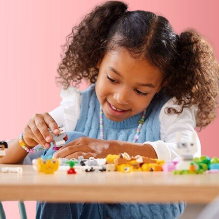girl playing with LEGO