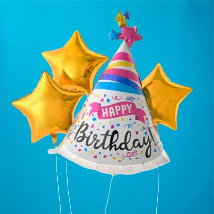 party hat and star mylar balloons on blue background