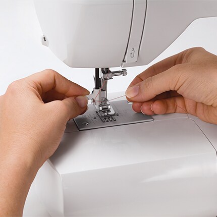 handles threading a sewing machine
