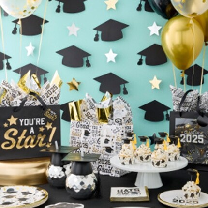 Graduation party decorations on table and wall