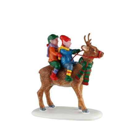 figurine of elves riding a reindeer
