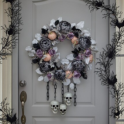 Halloween Decorative Wreath in Black and pink colors, with Ribbon, pumpkins and ghost decorations.