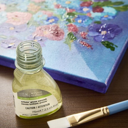 Various liquid varnish bottles on table