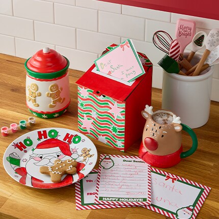 Finished Christmas craft kits. Cookies sitting on a plate with cookie jar, mug, and a box for a letter to Santa. 