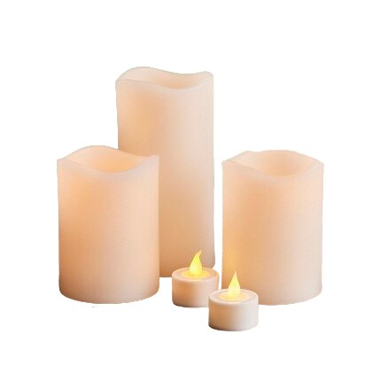 three pillar candles and two led tea light candles