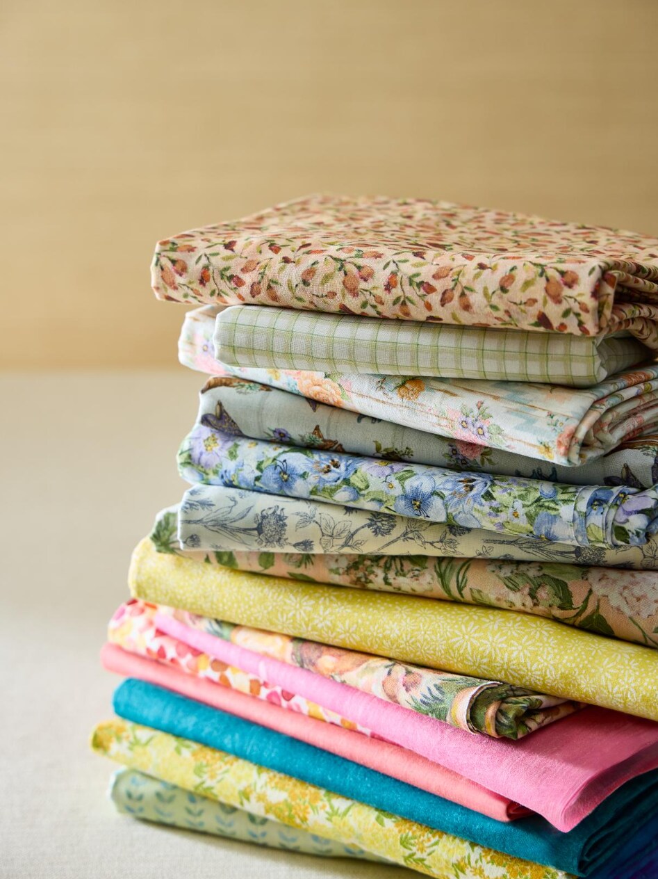 stack of assorted fabrics