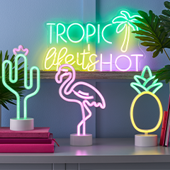 Neon summer lighting in shapes of cactus, flamingo and pineapple