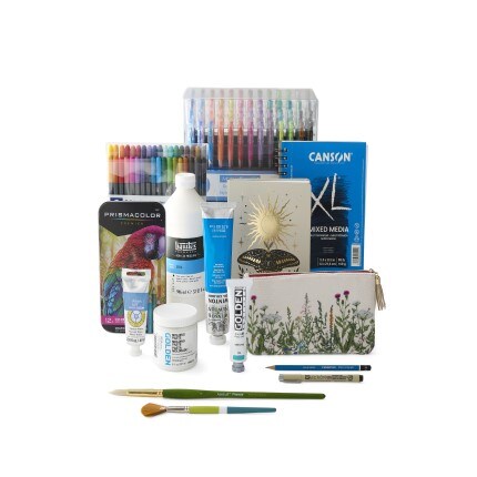 collage of paint, pens, markers, colored pencils, brushes paper pads sitting on table