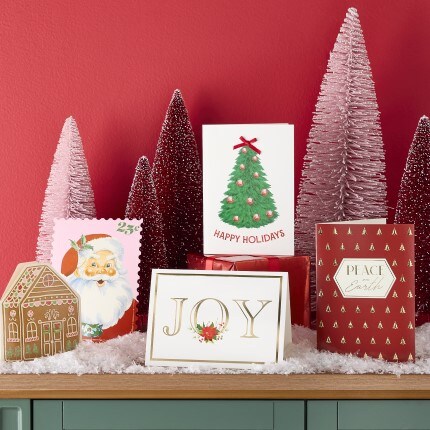 Christmas Cards on wood table with red background