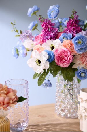 Flowers and vase on table