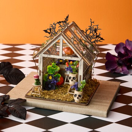 Halloween diorama kit wooden house with spooky skulls and bats on checker table