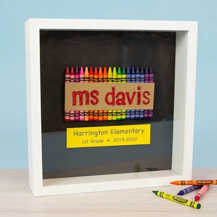 white shadow boxes with crayons and teacher name