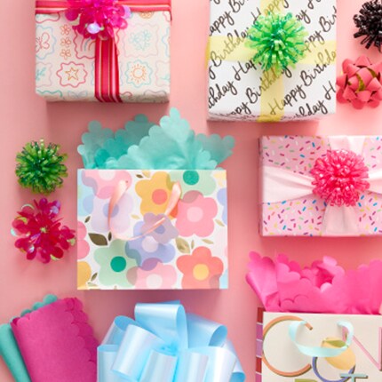 Party gift bags in pastel colors and floral designs