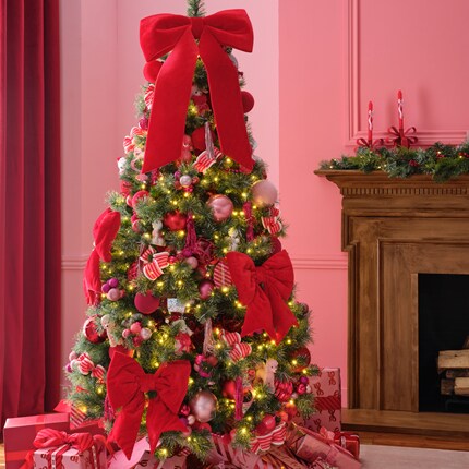 A christmas tree with presents and a fireplace