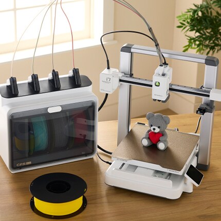 3D printer with yellow filament refill