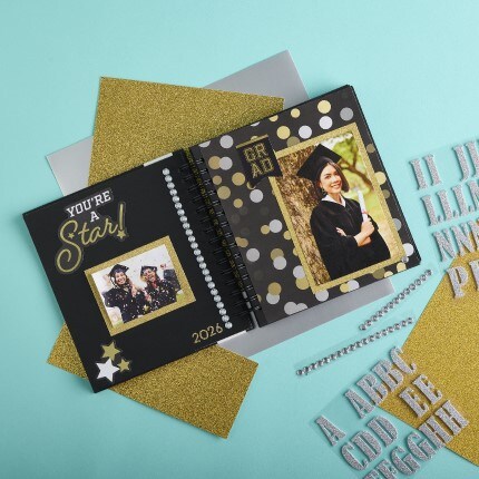 Grad album with scrapbooking page and decorated grad picture
