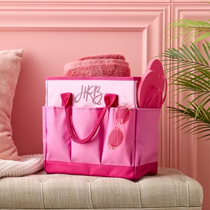 pink tote bag with flip flops and towel