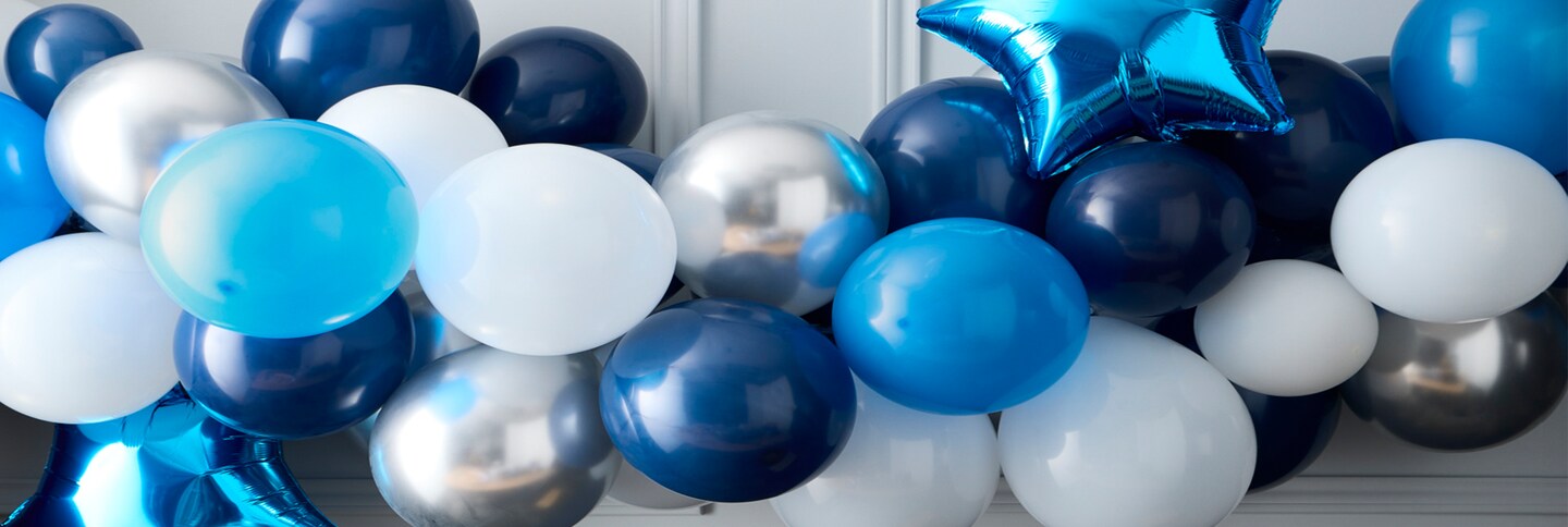rolls of navy, blue and silver ribbon