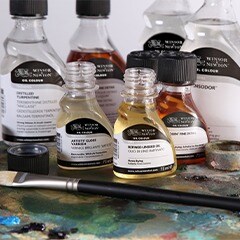 Various liquid varnish bottles on table