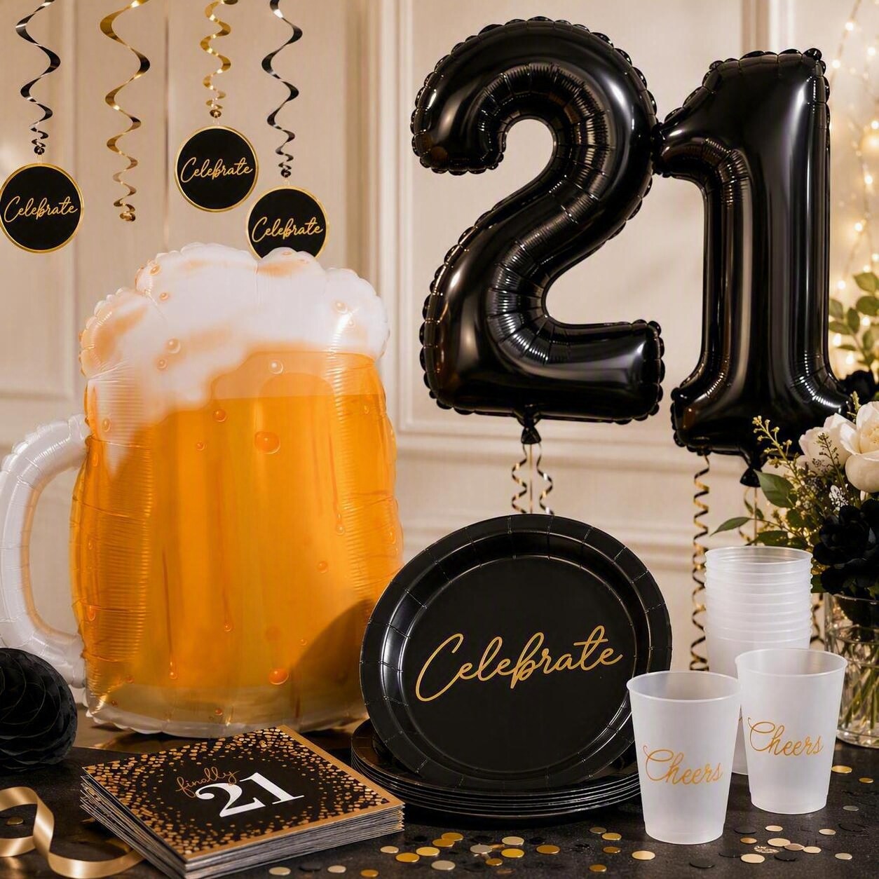 black "21" balloons, a beer mug balloon, cups and 21st birthday decorations